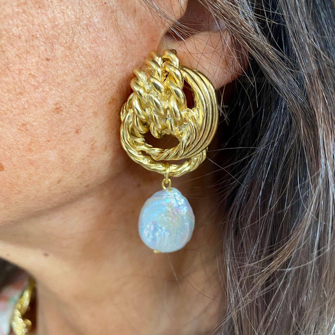 Clip on earrings with flat pearl drop